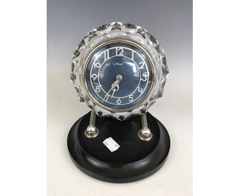 A Russian Art Deco adjustable mantle clock by Masaik, having teal enamelled face, silvered chapter, Arabic numerals and a cry