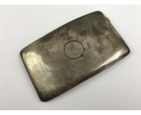 A George V silver cigarette case, of rounded rectangular section and convex form, having engine-turned decoration, A& J Zimme