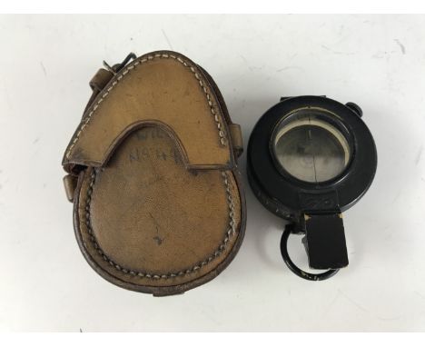 A 1940 British Army Mk III prismatic marching compass, in leather case 