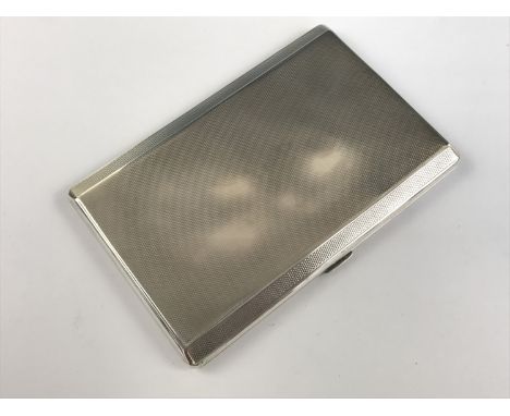 A George V silver cigarette case, rectangular with canted long edges, finely engine-turned overall, Thomas William Lack, Lond