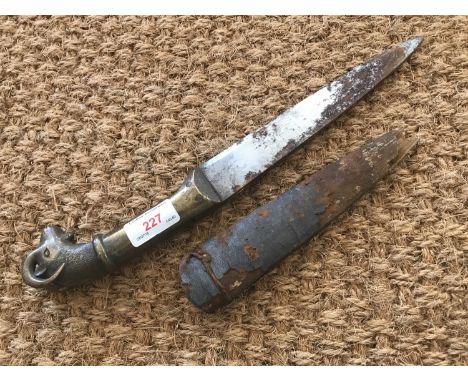 An Antique Indo-Persian brass-hilted dagger, the pommel modelled as a ram's head, 37 cm