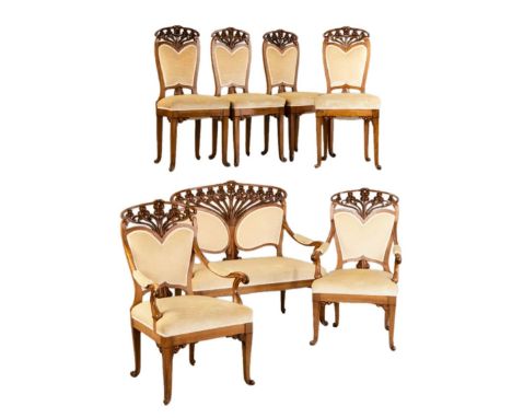 Furniture set in Art Nouveau (Modern) style, 7 parts, France, around 1905. Walnut, solid wood, with carved floral decoration.