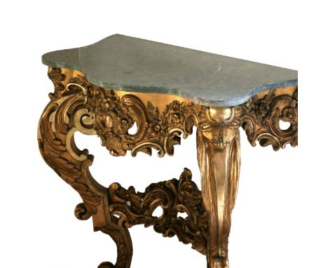 Wooden, gilded console of the 19th century.Wooden, gilded console of the 19th century, with a marble top, in the Rococo style