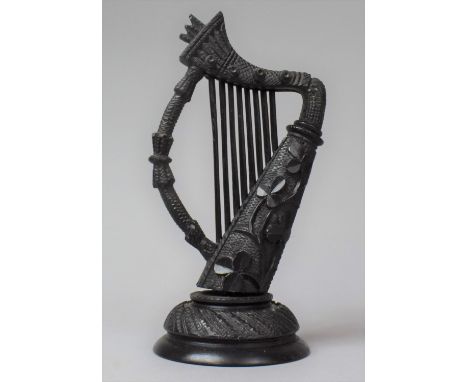 A Large Irish Carved Bog Oak Item in the Form of a Harp, 18cm high 