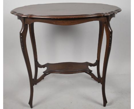 An Edwardian Mahogany Oval Topped Occasional table with Small Stretcher Shelf, 76cm wide 