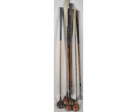 A Collection of Eight Vintage Golf Clubs to Include One Hickory Shafted Driver and the Remainder Metal Examples 