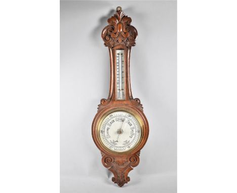 A Late Victorian Carved Oak Aneroid Wheel Barometer with Thermometer, Cracked Glass, 91cm high 