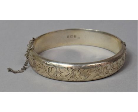 A Silver Bangle with Floral Decoration, Birmingham 1983 