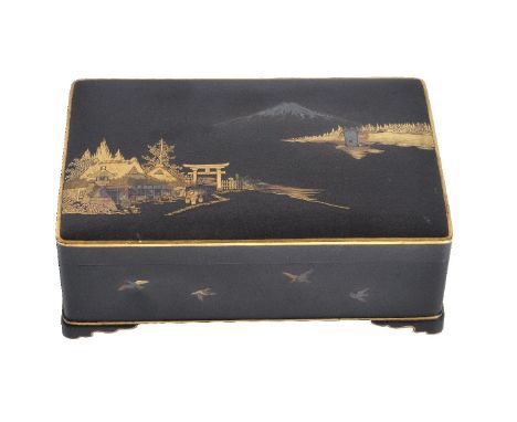 An Iron Komai-Style Cigarette Box, the rectilinear hinge-lidded box raised on bracket feet and decorated in typical gold and 