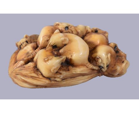 ϒMasamitsu: A Japanese Ivory Netsuke of a group of rats clambering in and around a sheaf of rice stalks, eyes inlaid, signed 