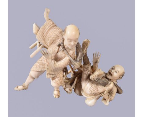 ϒA Japanese Ivory Okimono, depicting a man leaping up from one end of a bench, sending his companion on the other end crashin