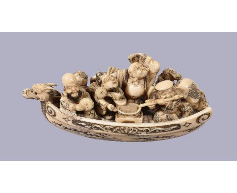 ϒGyokuhosai: A Japanese Ivory Netsuke of the Takarabune, with a dragon prow and carved beneath with swirling waves, the Shich