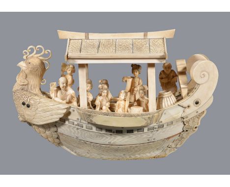 ϒA Japanese sectional ivory model of a boat, with cockerel prow and with seated figures, Meiji-Taisho Period, 32cm long ϒ Ind