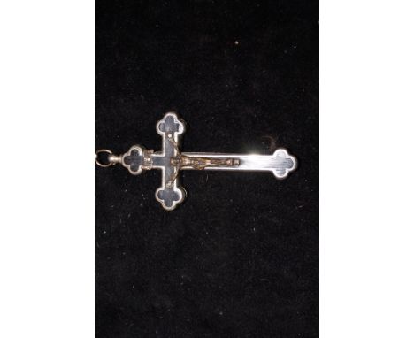 A large heavy cross pendent/trinket