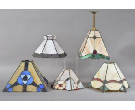 A collection of five Tiffany style light shades, for ceiling and table lights, one retaining the hanging bracket, total heigh