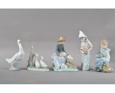 Five Nao porcelain figurines, comprising three children with animals, a figural group of goslings and a goose, the goose 15.5