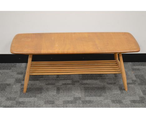 SALEROOM NOTICE - PLEASE NOTE THERE IS A SPLIT TO THE TOP, AF A 1960's/1970's elm Ercol coffee table, rounded rectangular top