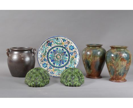 A 19th century continental ceramic plate, hand painted floral design with bold colours, some chips and crazing, 29cm diameter