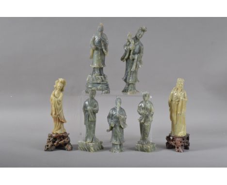 Seven 20th century Chinese carved hardstone figurines, five a dark green hardstone, two with bases, together with two larger 