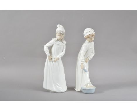 Two large Nao porcelain figurines, of two young children, both marked to the undersides, 29.5cm &amp; 28cm high (2) 