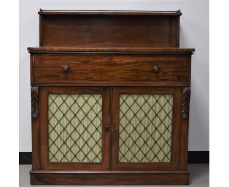 A 19th century mahogany secretaire cabinet, top shelf with a brass pierced gallery, raised with two columns the drawer with a