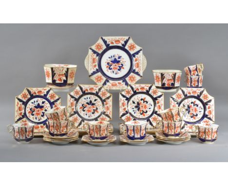 A late 19th century Wileman &amp; Co. Imari pattern tea service, numbered Rd. 6559, comprising a large plate 26cm wide, 10 cu