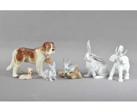 A collection of continental porcelain animal figurines, comprising a Lladro rabbit in natural surroundings, a bisque Kaiser e