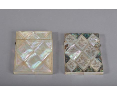 Two antique mother of pearl card cases, one with engraved floral design with green shell, the other plainer with engraved flo