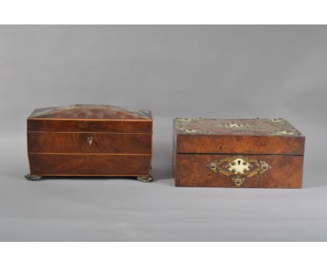 A 19th century burr walnut veneered sewing box, mounted with brass and ivory in a gothic style, internally with sewing relate