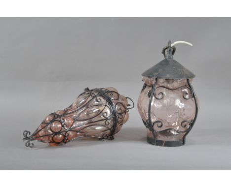 Two modern art nouveau inspired glass and metal lantern, both with pink glass on metal frames, 27cm &amp; 31cm high, both unt