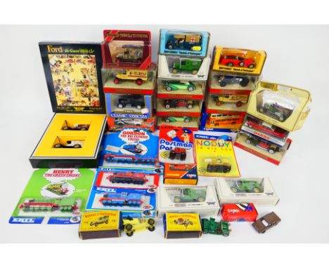 Matchbox - Ertl - Corgi - Matchbox Dinky - A group of boxed and carded diecast vehicles in various scales. Lot includes Match