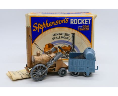 Benbros Qualitoys - A boxed Stephenson's rocket with coal tender. The model appears in Very Good condition overall but one of