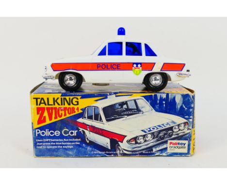 Palitoy - A boxed plastic 'Talking Z Victor 4' Police Car by Palitoy. The battery-operated model which is based on a Triumph 