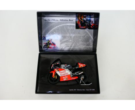 Minichamps - A boxed 1:12 scale Valentino Rossi Aprilia 250ccm 1998 Assen GP bike # 122093146. The model appears Mint, the bo