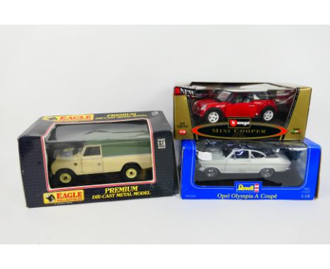 Eagle Collectibles - Revell - Bburago - Three boxed 1:18 scale diecast vehicles. Lot consists of Eagle Collectibles Land Rove