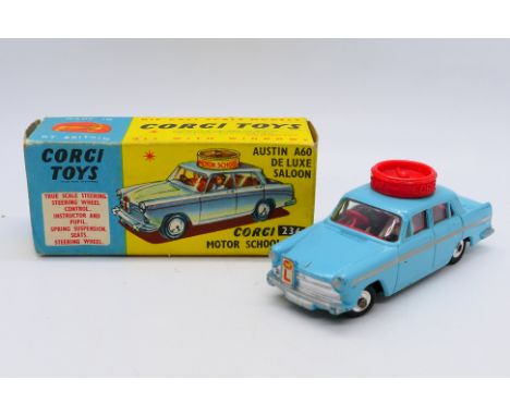 Corgi - An Austin A60 De Luxe Motor School car in light blue # 236. The model appears in Very Good condition in a Fair box, o