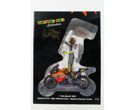 Minichamps - A limited edition Valentino Rossi Collection 1:12 scale Honda RC211V 1st Win Moto GP 2002 Repsol Honda Team with