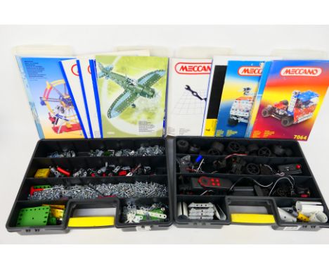 Meccano - 2 x boxes of Meccano parts, including 21 x Meccano instruction manuals - Lot includes wheels, tools, and similar. P