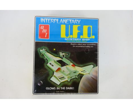 AMT - Interplanetary UFO - Mystery Ship. A boxed, factory sealed #S960 Interplanetary U.F.O Mystery Ship, plastic model kit w