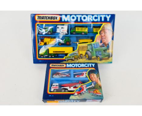 Matchbox - Two boxed Matchbox Motorcity Sets. Lot consists of Matchbox Motorcity MC-7 with MC12. Model in both sets appear Mi