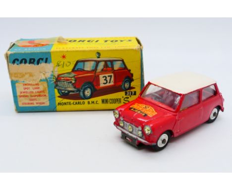 Corgi - A B.M.C. Mini Cooper S 1965 Monte-Carlo winner # 321. The cars shows signs of age and use and has lost the numbers fr