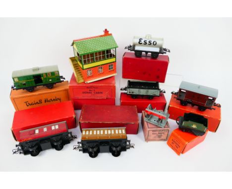 Hornby - 9 x boxed O gauge tinplate items including signal cabin # 42370, wagon with sheet rail # 42245, Esso petrol tank wag