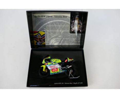 Minichamps - A boxed 1:12 scale Valentino Rossi Aprilia RSW 250ccm 1999 Mugello GP bike # 122990046. The model appears Mint, 
