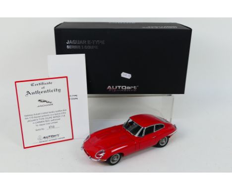 Autoart - A boxed 1:18 #73614 die-cast Jaguar E-Type Series 1 Coupe in red livery - Model comes within a polystyrene box with
