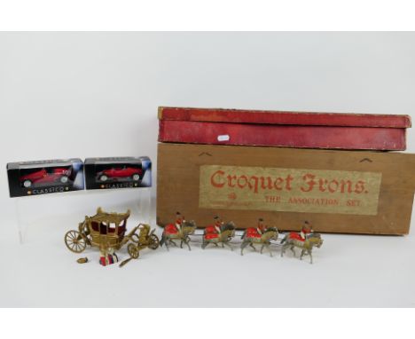 Britains - A boxed Britains Historical Series State Coach with King and Queen # 1470. The coach has several breaks and some p