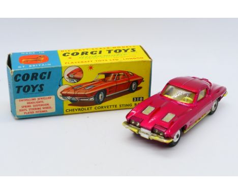 Corgi - A boxed Chevrolet Corvette Sting Ray Coupe in metallic red # 310. The model appears in Good condition overall with so