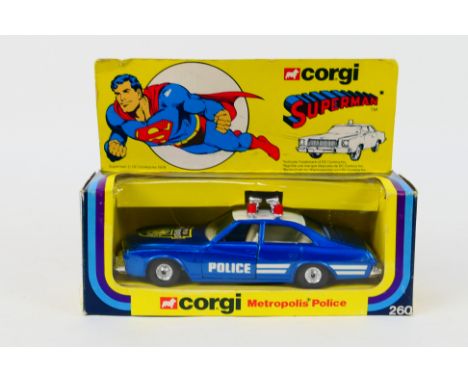Corgi - A boxed Corgi #260 'Superman' Metropolis Police Car. The Buick car in blue with white roof, white interior, and chrom