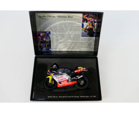 Minichamps - A boxed 1:12 scale Valentino Rossi Aprilia 250ccm 1999 GP bike Team Aprilia Grand Prix Racing # 122990086. The m