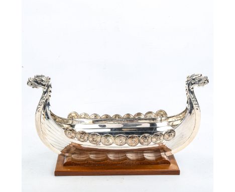 A large Vintage Norwegian silver plated Viking boat fruit bowl, modelled with removable Tage shield mounts and carved wood wa