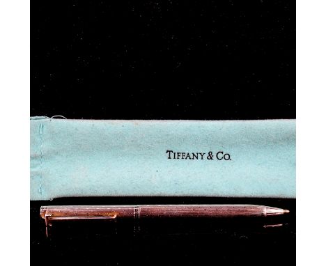 TIFFANY &amp; CO - a sterling silver T-clip retractable ballpoint pen, engine turned decoration, length 13cm, in sleeve&nbsp;